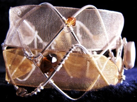 Bracelet - Sunbronze, sculptural cuff with silver and bronze ribbon weaved into a handcrafted silver wire frame