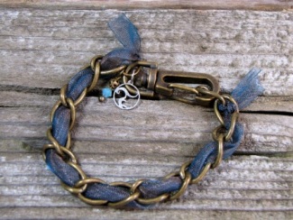 Bracelet - Cerulean Charm, Cerulean golden light ribbon woven into an antique brass chain with Swarovski crystal charm.